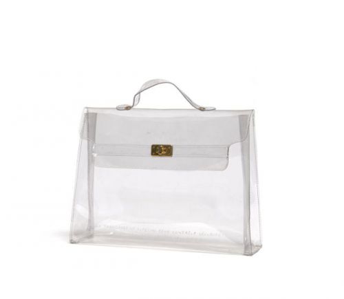 Sac en plastique transparent de forme Kelly édité et offert aux clientes pendant les collections de l'été 1996 (spécial pour contrôle sécurité).