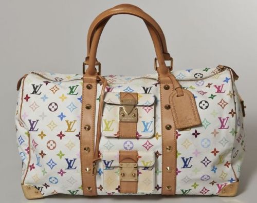 Louis VUITTON, Edition limitée, Keepall 50 en toile Monogram multicolore et cuir naturel partiellement clouté, coins en laiton, deux petites poches sur le devant, grande fermeture zippée, serrure sur le côté, intérieur en suède rouge bordeaux. Bel état ma