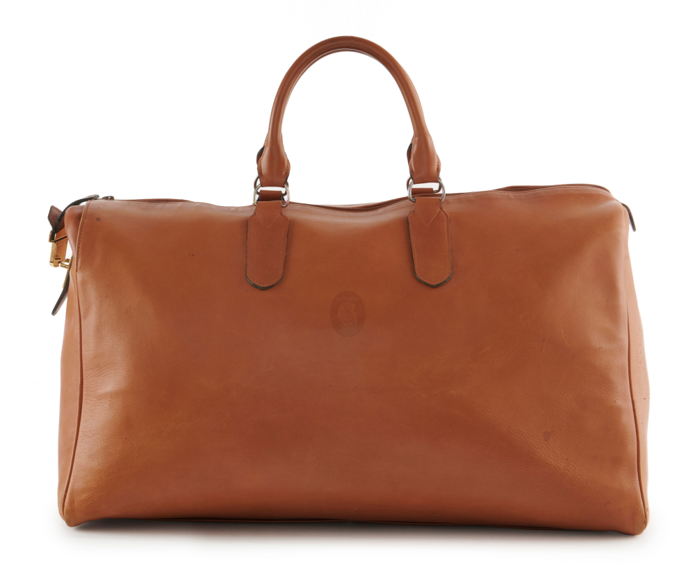 GOYARD  Sac de voyage Cuir camel Garniture métal doré Dimensions : 56 x 30 x 31 cm  Travel bag Camel leather Gilt...