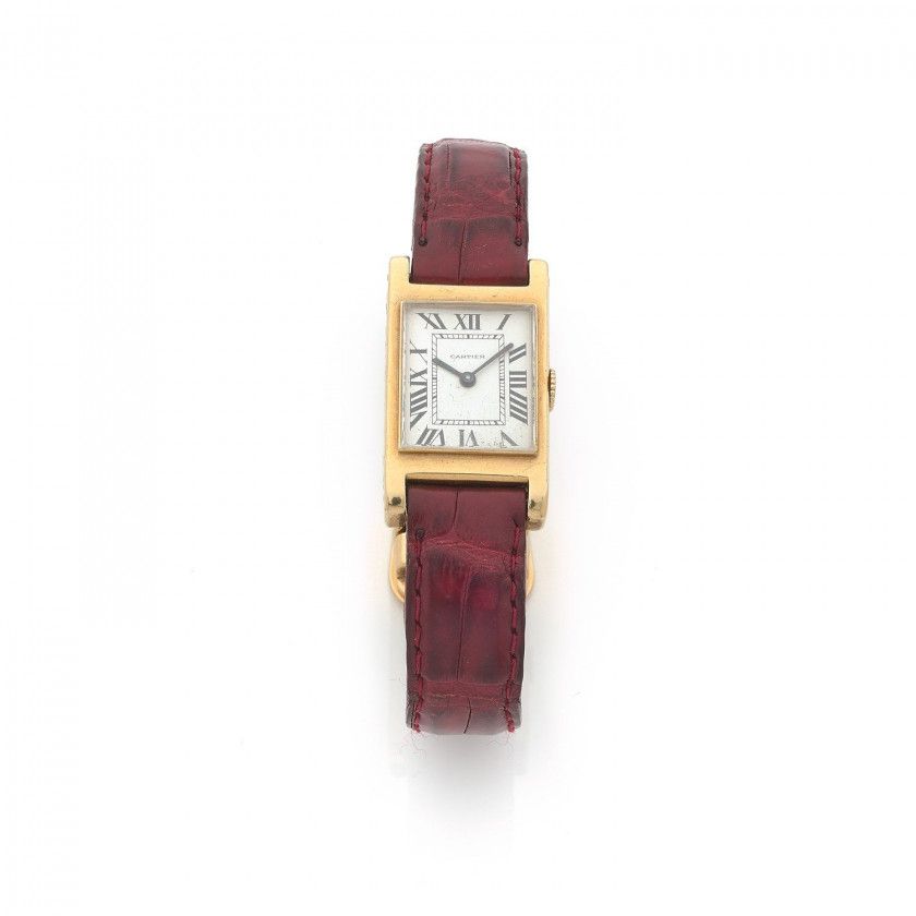 Attribué à CARTIER,Tank bec d'aigle, n° 83733,Vers 1940,Montre bracelet en or jaune 18k (750),Boîtier: rectangulaire, initiales gravées au dos JPH, numéroté au dos et à l'intérieur,Cadran: blanc, chiffres romains, minuterie chemin de fer, signé Cartier,Mo
