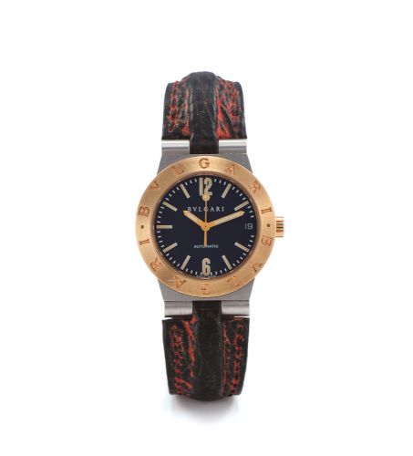 BVLGARI REF. LC 29 SG. STEEL AND YELLOW GOLD. Bvlgari, No. L 216, Ref. LC 29 SG. Made in the 1990's.. Fine, self-winding, steel and 18K yellow gold mid sized. wristwatch with steel and 18K yellow gold Bvlgari buckle.