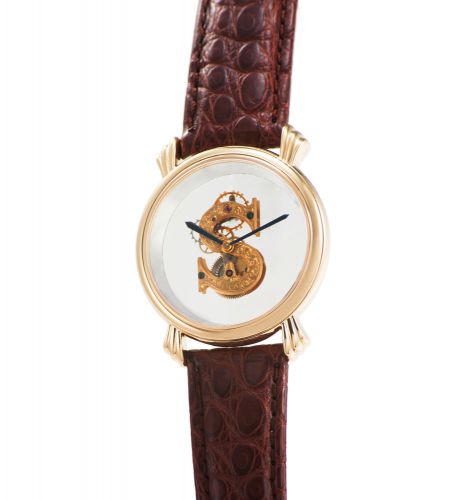 VINCENT CALABRESE SPATIALES YELLOW GOLD. Vincent Calabrese, Spatiales, No.1. Made in the 1990s.. Very fine and unusual, hand-made, 18K yellow gold wristwatch with visible movement with an 18K yellow gold Vincent Calabrese. buckle. Accompanied by hang tag.