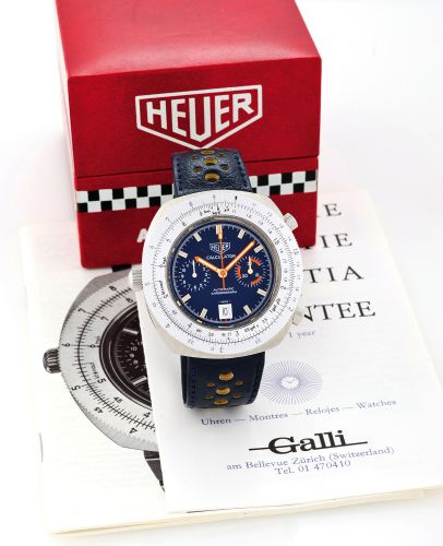 HEUER CALCULATOR.Heuer, Calculator, Automatic Chronograph, Ref. 110633. Sold on July 5th, 1973..ine and unusual, oversized, tonneau-shaped, water-resistant, self-winding stainless steel.left-handed wristwatch with round button chronograph, registers, date