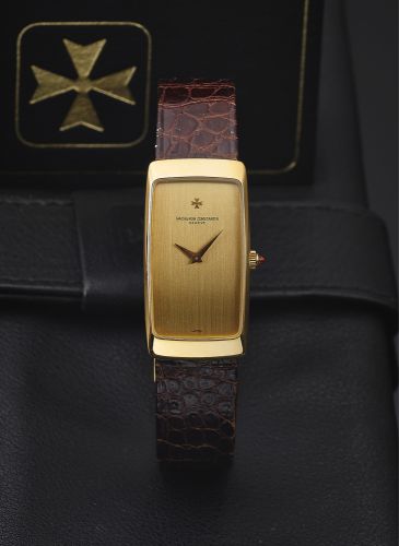 VACHERON CONSTANTIN REF. 35204 YELLOW GOLD.Vacheron Constantin, Genève, No. 694221, case No. 531541, Ref. 35204. Made in 1982, sold July 7th, 1983..Very fine and elegant, thin, rounded rectangular curved.18K yellow gold wristwatch with an 18K yellow gol