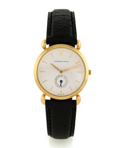 AUDEMARS PIGUET CLASSIQUE, DATE.Audemars Piguet, Date, case No. D260, Ref. BA25714. Made circa 1990..Fine and elegant, 18K yellow gold wristwatch with date and an.18K yellow gold Audemars Piguet buckle.