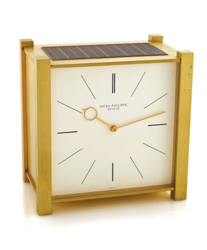PATEK PHILIPPE SOLAR CLOCK.Patek Philippe, Genève, Pendulette, movement No..872785, case No. 392, Ref. 1675. Made circa 1963..Fine and rare, solar-powered gilt-brass brass table.clock with electrically-wound remontoir.
