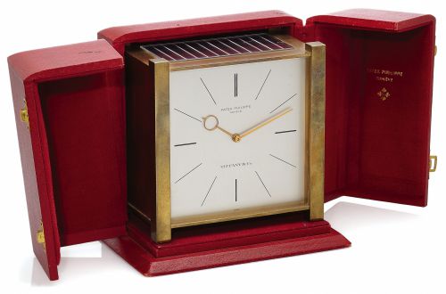 PATEK PHILIPPE SOLAR CLOCK RETAILED BY TIFFANY CO..Patek Philippe, Genève, Retailed by Tiffany Co. case No. 1646, Ref. 1675. Made circa 1963..Fine and rare, solar-powered gilt-brass table clock with solar powered electric winding system..Accompanied b