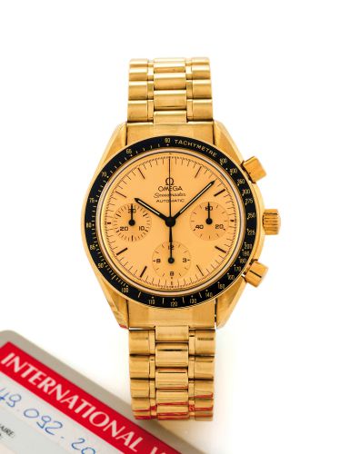 OMEGA SPEEDMASTER AUTOMATIC YELLOW GOLD.Omega, Speedmaster, Automatic, Ref. 1750032 BA. Made in the 1990s..Very fine, asymmetric, water resistant, self-winding, 18K yellow gold.wristwatch, with round button chronograph, registers, tachometer on.the gold b