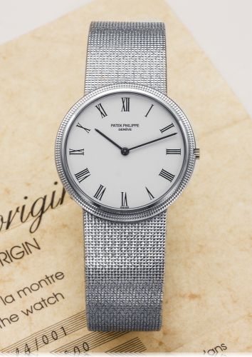 PATEK PHILIPPE REF. 3744 CALATRAVA WHITE GOLD.Patek Philippe, Genève, Calatrava, No. 1507800, Ref. 3744/1..Made in 1987..Very fine, thin and elegant, 18K white gold quartz wristwatch with.an 18K white gold Patek Philippe integrated blacelet..Accompanied b