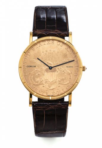 CORUM 20 DOLLAR COIN WATCH YELLOW GOLD.Corum, Coin Watch, No. 339886, case No. 508938..Made in the 1980..Fine, thin,18K yellow gold quartz wristwatch with 18K yellow.gold Corum buckle and inserted in a $20 US gold coin dated.1904.