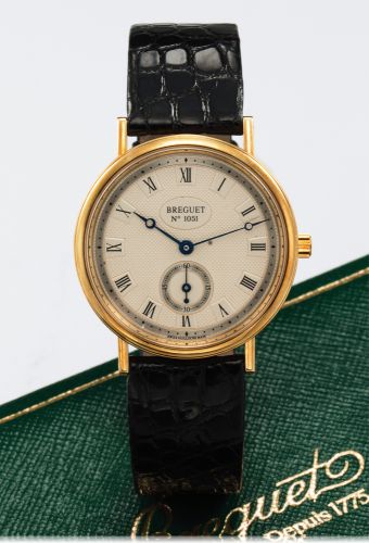 BREGUET REF. 3910 YELLOW GOLD.Breguet, No, 11181, case No. 1051, Ref. 3910. Made circa 1990's..Very fine and elegant, hand-winding, 18K yellow gold wristwatch with an 18K yellow gold Breguet buckle. Accompanied by an.original fitted box and an instruction