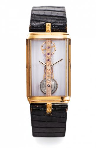 CORUM REF. 13150 GOLDEN BRIDGE YELLOW GOLD.Corum, Golden Bridge, case No. 07714, Ref. 13150. Made in the 1980s..Fine and unusual, manual-winding, rectangular, back winder, 18K.yellow gold wristwatch, with visible engraved special gold movement.all wheels 