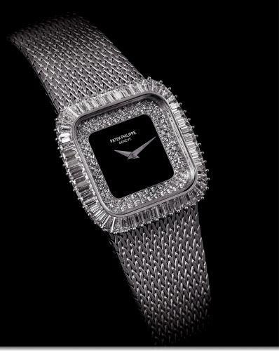 PATEK PHILIPPE REF. 3625 WHITE GOLD AND.DIAMOND.Patek Philippe, Genève, No. 1411237, case No. 2816437.Ref. 3625 / 1. Made in the late 1980s. Sold in March 11th, 1985..Very fine and rare, cushion-shaped, 18K white gold and diamonds.wristwatch with an integ