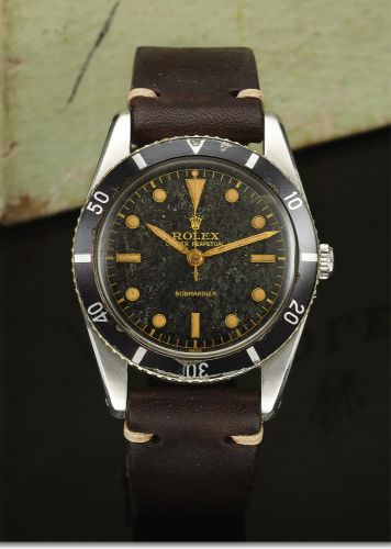 ROLEX REF 6204 SUBMARINER TROPICAL GILT DIAL STEEL.Rolex, Oyster Perpetual, Submariner, case No. 988772, Ref. 6204. Made in 1954..Fine and very rare, center seconds, self-winding, water-resistant stainless steel.diver's wristwatch. Accompanied by a fitted