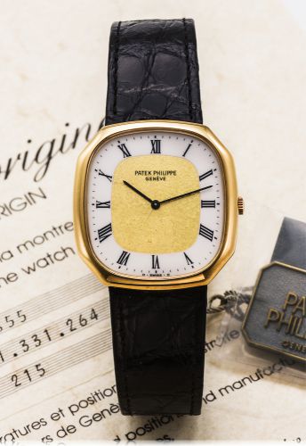 PATEK PHILIPPE REF. 3855.ENAMEL AND GOLD DIAL YELLOW GOLD.Patek Philippe, Genève, movement No. 1331264.Ref. 3855. Made in July 1987..Fine and rare, octagonal, hand-winding, 18K yellow.gold wristwatch with enamel chapter ring and with an.18K yellow gold Pa