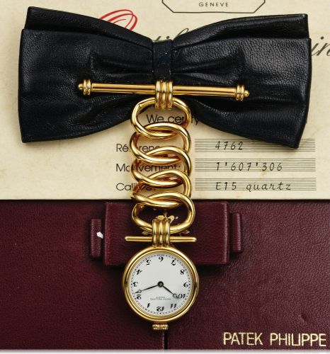 PATEK PHILIPPE REF. 4762.LEATHER BOW YELLOW GOLD.Patek Philippe Co., Genève, No. 1607306, case No..2870567, Ref. 4762. Made in a limited edition of 50 pieces.for the 150th Anniversary of Patek Philippe in 1989..Very fine and unusual, 18K yellow gold and