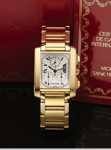 CARTIER REF. 1830 TANK FRANCAISE.QUARTZ CHRONOGRAPH YELLOW GOLD.Cartier, Tank Française, Chronograph, case No..MG 259325, Ref. 1830. Made circa 2000..Fine, rectangular curved, 18k yellow gold quartz wristwatch with square button chronograph, registers, da