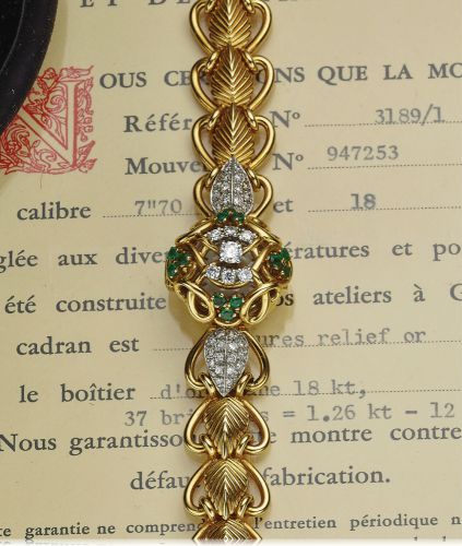 PATEK PHILIPPE REF. 3189.LADY'S.DIAMOND EMERALD CONCEALED DIAL.Patek Philippe Co., Genève, No. 947253, case No. 684911.Ref. 3189-1. Made in 1955..Very fine and elegant, 18K yellow gold, diamond and.emerald-set lady's bracelet watch with concealed dial