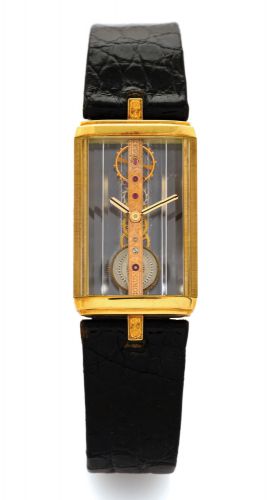 CORUM REF. 13150 GOLDEN BRIDGE YELLOW GOLD.Corum, Golden Bridge, Ref. 13150. Made in the 1980s..Fine and unusual, manual-winding, rectangular, back.winding, 18K yellow gold wristwatch, with visible engraved.special gold movement, all wheels and pinions fi