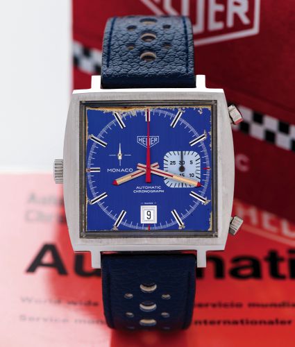 HEUER MONACO REF. 1533 ORIGINAL BOX GUARANTEE.Heuer, Monaco, Automatic, Chronograph, No. 1911, Ref. 1533B..Sold on January 25, 1978..Fine and unusual, cushion-shaped, self-winding, water resistant.stainless steel wristwatch with round button chronograph