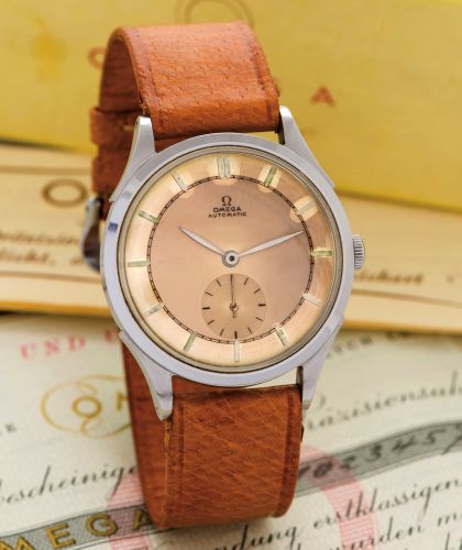 OMEGA REF. 2374 AUTOMATIC.ORIGINAL BOX AND PAPERS STEEL.Omega, Automatic, movement No. 10234579, Ref. 2374/2..Sold on May 24, 1946..Fine and rare, self winding, stainless steel wristwatch with.bumper rotor. Accompanied by the original Omega card.box, guar