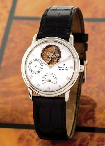 BLANCPAIN TOURBILLON.POWER RESERVE DATE PLATINUM.Blancpain, JB 1735 - Tourbillon, No. 82, Ref. 0023. Made in the.1990's..Very fine and rare, stainless steel wristwatch with 8-day power.reserve, visible one-minute tourbillon regulator with off-centred.bala