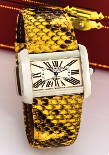 CARTIER REF. 2612 TANK DIVAN STAINLESS STEEL.Cartier, Tank Divan, Automatic, No. 155517CE, Ref. 2612. Made in.the 2000s..Fine, horizontal rectangular and curved, center-seconds, self-winding.water resistant, stainless steel wristwatch with a Cartier stain