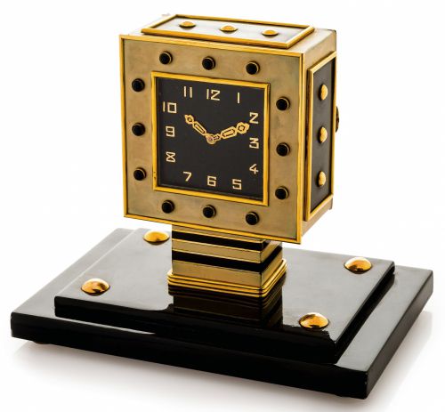 LACLOCHE FRERES - SILVER GOLD ART DECO CLOCK.Lacloche Frères, No. 874/1034. The case with London import marks for 1929-30..Fine and very rare, Art-Deco, lacquered silver, yellow gold and onyx-set, 8-day going table clock.