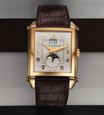 GIRARD PERREGAUX VINTAGE 1945 XXL LARGE DATE MOON PHASES PINK GOLD.Girard-Perregaux, Large Date Moon-Phase, No. 49, Ref. 25882. Sold on April 29th, 2013..Very fine, square curved, self-winding, 18K pink gold wristwatch with large date, moon phases, lunar.