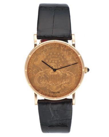 CORUM 20 DOLLAR COIN WATCH YELLOW GOLD.Corum, Coin Watch, movement No. 78292, case No..8978113. Made in the 1980's..Fine, thin, 18K yellow gold wristwatch inserted in a $20.US gold coin dated 1904 with an 18K yellow gold Corum.buckle.