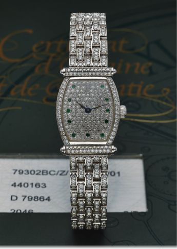 AUDEMARS PIGUET REF 79302BC CARNEGIE WHITE GOLD.DIAMOND AND EMERALD.Audemars Piguet, Genève, Carnegie, movement No. 440163, case No. D 79864, Ref. 79302BC..Made in the 1990s..Very fine, tonneau-shaped, 18K white gold, diamond and emerald-set lady's tonnea