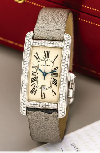 CARTIER TANK AMERICAINE, WHITE GOLD.DIAMONDS.Cartier, Tank Americaine, case No. 606003MG, Ref. 2490. Sold in.November 2001..Very fine, rectangular curved, center seconds, self-winding, water-.resistant, 18k white gold and diamond-set wristwatch with date.