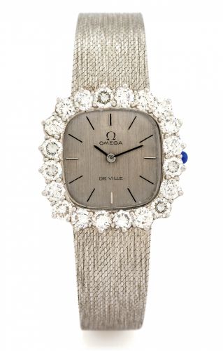 OMEGA DE VILLE.LARGE.DIAMONDS WHITE GOLD.Omega, De Ville, movement No. 24388225, Ref. 1011..Made circa 1970..Fine and very elegant, 18K white gold lady's wristwatch set with twenty large brilliant-cut white diamonds and an.integral 18K white gold textur