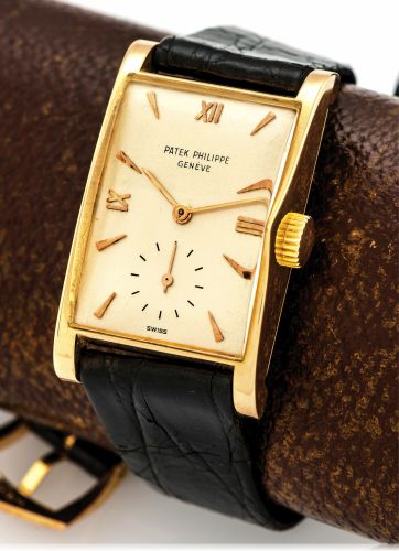 PATEK PHILIPPE REF. 1588 PINK GOLD.Patek Philippe Co, Genève, movement No. 972839, case No..661359, Ref. 1588. Made circa 1945..Very fine and rare, rectangular curved, 18K pink gold wristwatch with a later 18k pink gold Patek Philippe buckle. Accompanie