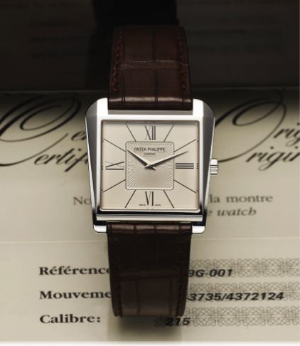 PATEK PHILIPPE REF. 5489 WHITE GOLD.Patek Philippe Cie, Geneve, No. 1343735, case No. 4372124.Ref. 5489G. Sold August 28th, 2008..Fine and unusual, asymmetric trapezoidal, 18K white gold.wristwatch with an 18K white gold Patek Philippe buckle..Accompani