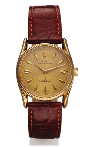 ROLEX REF. 6593 BOMBAY YELLOW GOLD.Rolex, Oyster Perpetual, Officially Certified Chronometer, Bombay.Ref. 6593. Made in the 1950's..Fine, centre second, self-winding, water-resistant, 14K yellow gold.wristwatch with a gold-plated Rolex buckle.