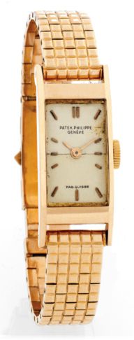 PATEK PHILIPPE REF. 2292 PINK GOLD.Patek Philippe, Genève, No. 843539, case No. 678945, Ref. 2292..Made in 1954, sold on March 12, 1955..Very fine and rare, rectangular, bombé, 18K pink gold wristwatch with an 18K pink gold bracelet with clous de Paris de