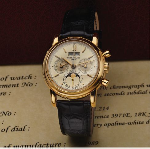 PATEK PHILIPPE REF 3971E YELLOW GOLD.Patek Philippe, Genève, No.875379, case No. 2851214, Ref. 3971E. Sold on July 18, 1989..Very fine and very rare, astronomic, 18K yellow gold wristwatch with round button.chronograph, registers, perpetual calendar, moon