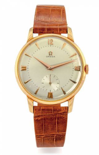 OMEGA REF. 2687 PINK GOLD.Omega, movement No. 13836583, case No. 11294133.Ref. 2687. Made in the 1950s..Fine, large, 18K pink gold wristwatch with a gold-plated.Omega buckle..Dial, case and movement signed.