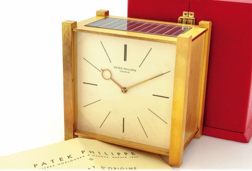 PATEK PHILIPPE SOLAR CLOCK.ORIGINAL BOX CERTIFICATE.Patek Philippe, Genève, case No. 966, movement No. 873425.Ref. 902.50. Made in the 1960s..Fine and rare, solar-powered gilt-brass table clock with solar.powered electric winding system. Accompanied by 