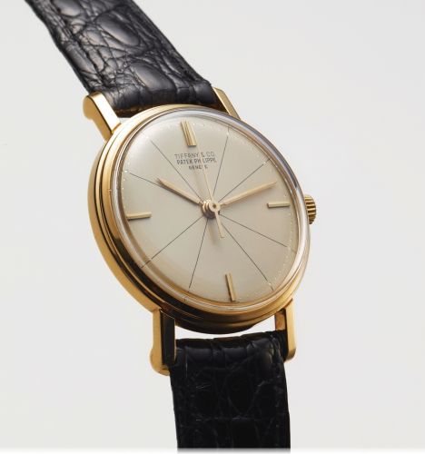 PATEK PHILIPPE REF. 3423 RETAILED BY TIFFANY CO YELLOW GOLD.Patek Philippe, Genève, No. 707951, case No. 2611125, Ref. 3423, retailed by tiffany. Made circa 1960..Very fine and rare, indirect center-seconds, 18K yellow gold wristwatch. Accompanied by an