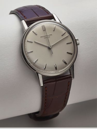 PATEK PHILIPPE REF. 3411 WHITE GOLD.Patek Philippe, Genève, No. 711080, case No. 2633943, Ref. 3411. Made in 1963, sold on.Decmber 10th, 1963..Very fine and rare, center seconds, 18K white gold wristwatch with 18K white gold deployant.clasp. Accompanied b