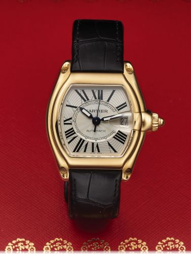 CARTIER REF. 2524 ROADSTER YELLOW GOLD.Cartier, Roadster, Automatic, case No. 852740 CD.Ref. 2524. Made circa 2006..Fine, tonneau-shaped, curved, center seconds, self-winding.water resistant to 100 m, 18K yellow gold wristwatch with date.and a quick chang