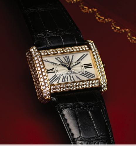 CARTIER TANK DIVAN YELLOW GOLD.DIAMOND.Cartier, Tank Divan, case No. 275387. Ref. 2603. Made in 2004..Fine and unusual, horizontal rectangular and curved.automatic, center-seconds, water-resistant, lady's 18K yellow.gold and diamond-set wristwatch with an