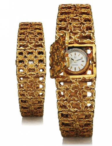 OMEGA REF. 7148 CONCEALED DIAL.DESIGNED BY GILBERT ALBERT.Omega, No. 23203977, case No. 996707, Ref. 7148..Made circa 1968. Designed by Gilbert Albert..Fine, rare and elegant, 18K yellow gold lady's back-wound.wristwatch with concealed dial and an integra