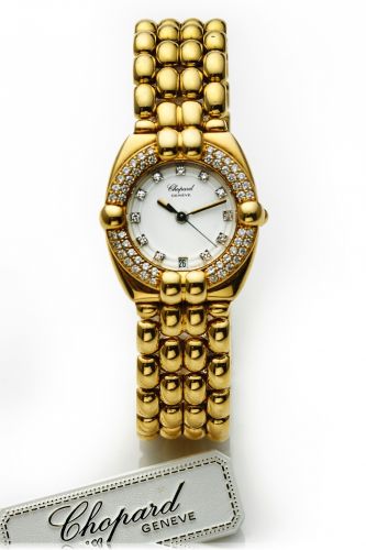 CHOPARD REF. 5229 GSTAAD LADY'S.YELLOW GOLD AND.DIAMONDS.Chopard, Genève, Gstaad, case No. GD4320, Ref. 5229..Made in the 1990's..Fine and elegant, tonneau-shaped, center seconds, water-.resistant, 18K yellow gold and diamonds lady's quartz.wristwatch wit
