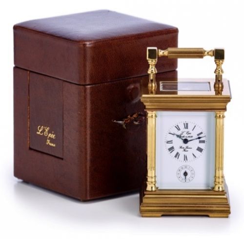 L'EPÉE CARRIAGE CLOCK.L'Epée, France. Made in the late 20th century..Fine, gold-plated, 8-day going, hour and alarm.carriage clock. Accompanied by a fitted box and key.