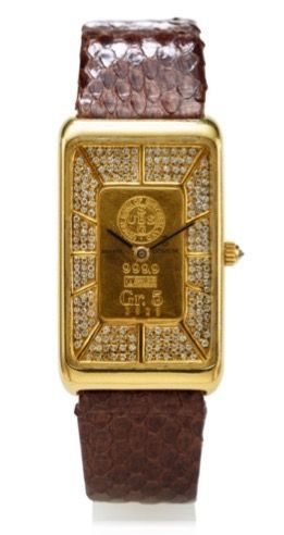 CORUM 5 GR. GOLD INGOT QUARTZ.WRISTWATCH YELLOW GOLD.Corum, Ingot Watch, No. 3825, case No. 356017..Made in the 1980s..Fine, rectangular, 18K yellow gold wristwatch made of a 5 gram 999.9 gold ingot..Dial, case and movement signed.
