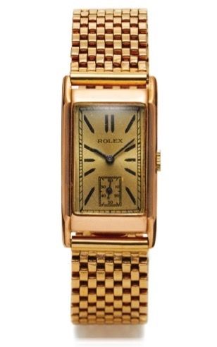 ROLEX REF. 1879 14K YELLOW GOLD.Rolex, case No. 8683, Ref. 1879, Made circa 1930..Fine, elegant and rare, rectangular curved, 14K yellow.gold wristwatch with non original yellow gold bracelet.