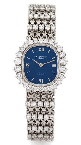 PATEK PHILPPE REF. 4137/1.ELLIPSE WHITE GOLD AND.DIAMONDS.Patek Philippe, Genève, Ellipse, retailed by Gübelin.movement No. 1271437, case No. 2752232, Ref. 4137/1. Made circa 1975..Very fine and elegant, 18K white gold and.diamond-set lady's wristwatch wi